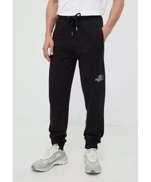 The North Face Mens Drew Peak Pants. - - .  Elastic waistband and drawstring, fleece lining. - - . 2 Side Entry Pockets With Zip Closure. - - . Rib hem, brand logo printed on left hip and back right calf.