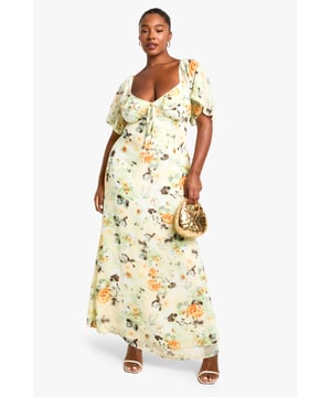 Flowing chiffon maxi dress with eye-catching floral print throughout
        Feminine sweetheart neckline complemented by delicate ruffle detailing
        Flattering short flutter sleeves that add movement and dimension
        Full-length maxi silhouette designed to showcase your curves
        Fully lined for comfort and confidence while maintaining a lightweight feel
    
    Make a statement at your next night out in this captivating plus-size maxi dress from Boohoo. The romantic ruffle detailing and sweetheart neckline create a flattering focal point, while the flowing chiffon fabric moves beautifully with every step. Style with strappy metallic heels and a compact clutch as seen on our model for an effortlessly chic evening ensemble. Perfect for summer cocktails, rooftop parties or dinner dates, this dress transitions seamlessly from day to night with a simple change of accessories. Add delicate jewellery and a lightweight wrap for cooler evenings, or dress it down with flat sandals for daytime gatherings. The versatile print works brilliantly across seasons, making this a wardrobe staple you'll reach for time and again.