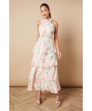 Halterneck design with a daring keyhole detail
        Tiered maxi silhouette for a romantic, flowing look
        Delicate floral print throughout
        Open back with thin straps for an alluring touch
        Lightweight chiffon fabric perfect for warm-weather events
    
    Embrace the essence of summer sophistication with this enchanting floral printed maxi dress from Oasis. The halterneck design, adorned with a subtle keyhole detail, creates an elegant neckline that draws attention upwards. The tiered silhouette cascades gracefully to the floor, offering a dreamy, ethereal quality that's perfect for special occasions. The open back adds a touch of allure, while the thin straps ensure a secure fit. Style this dress for a garden wedding by pairing it with strappy metallic sandals and delicate drop earrings. For a day at the races, opt for a fascinator and a clutch bag to complete your ensemble. The versatile nature of this dress allows for both formal and semi-formal styling, making it a valuable addition to your wardrobe for various summer events.
