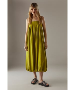 Strappy design with delicate shoulder straps
        Seam detail on bodice creating a pleated effect
        Bubble hem for a playful silhouette
        Midi length for versatile styling
        Relaxed fit through the body for effortless comfort
    
    This strappy seam detail bubble midi sundress from Warehouse is the epitome of casual chic. Perfect for those laid-back summer days, this dress combines comfort with style. The pleated bodice adds texture and interest, while the bubble hem creates a playful, feminine silhouette. Pair it with flat sandals and a woven tote for a relaxed daytime look, or dress it up with wedges and statement earrings for an alfresco dinner. The versatile midi length makes it suitable for various occasions, from family gatherings to casual brunches with friends. Layer with a denim jacket for cooler evenings or style with a wide-brimmed hat for a touch of glamour at outdoor events. This dress is a wardrobe essential that effortlessly transitions from day to night, embodying the confident and edgy spirit of the Warehouse brand.