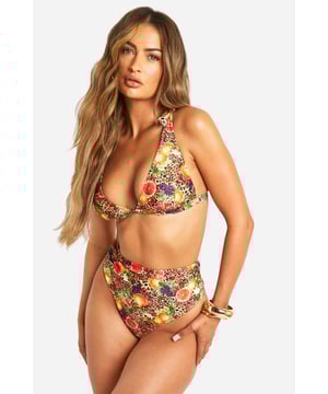 Eye-catching leopard and floral print bikini
        Plunge neckline for a flattering silhouette
        Adjustable lace-up straps for a customised fit
        High-waisted bottoms for added coverage
        Stretchy fabric for comfort and ease of movement
    
    Make a splash this summer with this bold and beautiful bikini from Boohoo. The striking combination of leopard print and vibrant florals creates a head-turning look that's perfect for beach days and poolside lounging. The plunging neckline and lace-up straps add a touch of allure, while the high-waisted bottoms offer a flattering fit and extra coverage. Style with oversized sunglasses and a wide-brimmed hat for ultimate holiday glamour. Whether you're jetting off to a tropical paradise or soaking up the sun at a local lido, this versatile two-piece will ensure you stand out from the crowd. Pair with a sheer kaftan and strappy sandals for effortless beach-to-bar transitions, or layer under a crisp white shirt dress for stylish seaside strolls.