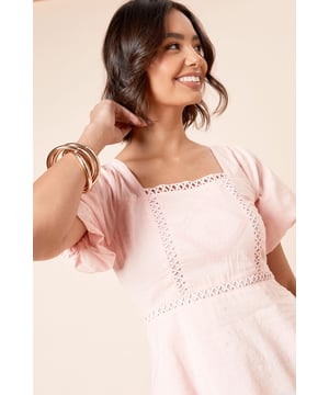 Elegant square neckline with delicate embroidered detailing
        Feminine flutter sleeves for a soft, romantic look
        Flattering peplum silhouette that gently flares at the waist
        Charming tie-back detail adding interest to the rear view
        Crafted from a breathable cotton-linen blend for all-day comfort
    
    This Dorothy Perkins top combines timeless charm with contemporary styling. The square neckline frames your dcolletage beautifully, while the intricate embroidery adds a touch of artisanal flair. Perfect for casual gatherings, style it as shown with wide-leg denim and simple sandals for a relaxed brunch with friends. The peplum shape skims the waistline whilst creating a flattering silhouette that works wonderfully for family gatherings or baby showers. For cooler days, layer with a lightweight cardigan and accessorise with gold-toned jewellery to enhance the top's feminine appeal. The tie-back detail offers a subtle point of interest when you turn, ensuring this versatile piece looks lovely from every angle.
