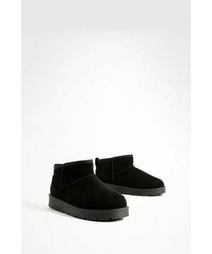 Ultra mini design for a trendy, compact silhouette
        Cosy synthetic suede upper for warmth and comfort
        Slip-on style for easy wear
        Durable synthetic outer sole for traction
        Versatile ankle height suitable for various outfits
    
    Step into comfort and style with these ultra mini cosy boots from Boohoo. Perfect for the fashion-forward woman who values both trend and practicality, these boots offer a snug fit that's ideal for chilly days. The ankle-height design makes them incredibly versatile, pairing effortlessly with everything from skinny jeans to midi skirts. For a laid-back look, team them with oversized knitwear and leggings, or dress them up with a flowy dress and tights for casual outings. These boots are a must-have for family gatherings, coffee dates, or weekend shopping trips. Their compact size makes them an excellent choice for travel, easily fitting into your luggage without sacrificing style. Embrace the cosy-chic trend and make these ultra mini boots your go-to footwear for comfortable, on-trend casual wear.