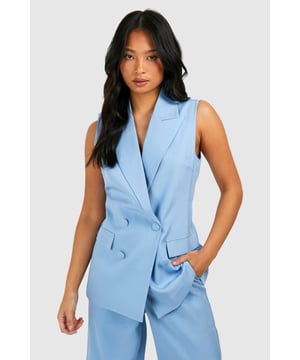 Sleeveless design for a modern, chic look
        Double-breasted front with button closure
        Notched lapels for a classic blazer silhouette
        Functional front pockets for added practicality
        Tailored fit to flatter the petite frame
    
    Make a bold statement with this sleeveless blazer, perfect for the fashion-forward woman who loves to stand out. The tailored fit accentuates your silhouette, while the sleeveless design adds a contemporary twist to the classic blazer. Pair it with the matching wide-leg trousers for a coordinated power suit look that's ideal for a night out on the town. For a more casual ensemble, throw it over a crop top and high-waisted jeans. Accessorise with statement earrings and a clutch bag to complete your look. Whether you're heading to a trendy bar or meeting friends for drinks, this versatile piece will ensure you're dressed to impress. The double-breasted front and notched lapels add a touch of sophistication, making it suitable for both casual and semi-formal occasions. Embrace your confidence and let this blazer be the centrepiece of your going-out wardrobe.