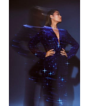 Dazzling all-over sequin embellishment
        Plunging neckline for a bold statement
        Structured shoulders and tailored fit
        Long sleeves with padded shoulders
        Versatile piece for festive occasions
    
    Make a grand entrance at your next Christmas soire with this show-stopping velvet sequin blazer. The plunging neckline adds a daring touch, while the all-over sequin embellishment ensures you'll sparkle from every angle. Perfect for those who love to stand out, this blazer can be styled multiple ways for various festive celebrations. Pair it with matching sequin trousers for a head-to-toe glam look, or throw it over a little black dress for instant glamour. The structured shoulders and tailored fit create a flattering silhouette, making it ideal for Christmas parties or New Year's Eve bashes. Accessorise with statement earrings and sky-high heels to complete your party-ready ensemble. This versatile piece will become your go-to for adding a touch of sparkle to any festive outfit.