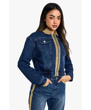 Distinctive corduroy collar and trim detailing
        Classic button-up front closure
        Functional chest pocket for added utility
        Cropped length for a modern silhouette
        Versatile denim construction for year-round wear
    
    Embrace the fusion of classic and contemporary with this eye-catching jeans jacket from Boohoo. The corduroy collar and trim inject a touch of retro charm, whilst the cropped silhouette keeps the look firmly on-trend. Perfect for layering, this jacket is a versatile piece that can be styled for various casual occasions. Pair it with high-waisted jeans and a simple white tee for a laid-back weekend look, or throw it over a floral dress and trainers for a fun family gathering. The functional chest pocket adds a practical element to the design, ideal for keeping small essentials close at hand. Whether you're heading to a casual lunch with friends or a relaxed evening out, this jacket will add an effortless cool to your ensemble. Its adaptable nature makes it a wardrobe staple that can transition seamlessly from day to night, ensuring you're always ready for wherever your social calendar takes you.