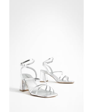 Uncomfortable stilettos ruining your vibe? Choose a pair of block heel sandals from our latest collection. Pretty, practical, and seriously comfy, this is a low-heel style we high-key love. Featuring a wide, chunky block heel that provides maximum comfort (bonus), this style is perfect for dancing the night away...no blister plasters necessary. Just pair with your fave Saturday night fit and you're good to go.Style: 2 Part HeelsFabric: PU