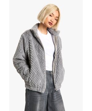 Textured oversize faux fur jacket with striking chevron pattern
        Cosy high collar for extra warmth and style
        Relaxed fit with dropped shoulders for effortless layering
        Convenient side pockets for practicality
        Versatile zip-up front for adjustable coverage
    
    Embrace the chilly season with this eye-catching textured faux fur jacket. The bold chevron pattern adds a touch of sophistication to your casual wardrobe, while the oversize silhouette ensures maximum comfort. Perfect for those laid-back weekend brunches or impromptu coffee dates, this jacket pairs beautifully with wide-leg jeans and trainers for an effortlessly cool look. Layer it over a simple white tee and add a slouchy tote bag to complete your ensemble. The cosy high collar and soft texture make it ideal for snuggling up during outdoor events or family gatherings. Whether you're heading to the local pub or a casual dinner party, this jacket will keep you warm and stylish throughout the autumn and winter months.