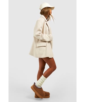 Cosy borg material for ultimate comfort
        Stylish platform design with a flat heel (0-2cm)
        Embroidered detailing adds a unique touch
        Slip-on style for easy wear
        Versatile mule silhouette for indoor and outdoor use
    
    Step into comfort and style with these eye-catching borg mules. The plush texture of the borg material envelops your feet in warmth, making them perfect for lounging at home or running quick errands. The platform design adds a trendy edge, while the flat heel ensures all-day comfort. The embroidered detailing elevates these mules from simple house shoes to a fashion statement. Pair them with your favourite joggers and an oversized jumper for a cosy day in, or style them with cropped jeans and a chunky knit for casual outings. These versatile slip-ons are ideal for family gatherings, lazy weekends, or any occasion where you want to combine comfort with a touch of flair. The easy slip-on style means you can quickly transition from indoor relaxation to outdoor adventures without missing a beat.