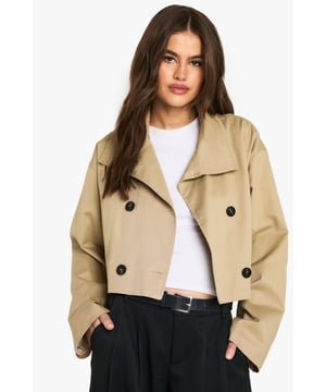 Chic cropped trench coat design
        Distinctive funnel collar for added style
        Double-breasted button fastening
        Wide, relaxed sleeves for a modern silhouette
        Versatile length perfect for layering
    
    This contemporary take on the classic trench coat is a must-have addition to your wardrobe. The cropped length and funnel collar create a fresh, youthful look that's perfect for the fashion-forward Boohoo girl. Style it with wide-leg trousers and a crisp white tee for a polished daytime ensemble. For a night out with the girls, throw it over a bodycon dress and pair with ankle boots. The relaxed fit allows for easy layering over jumpers when the temperature drops. Whether you're heading to uni, meeting friends for brunch, or enjoying a casual family gathering, this trench coat will keep you looking effortlessly stylish. Its versatility makes it an ideal choice for those impromptu plans that pop up in your busy social calendar.