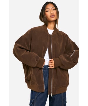 Oversized silhouette for a relaxed, on-trend look
        Faux suede fabric adds a luxurious touch
        Ribbed cuffs and hem for a snug fit
        Full-length zip closure for easy wear
        Versatile bomber style suitable for various casual occasions
    
    Make a statement with this oversized bomber jacket in faux suede. The relaxed fit embodies effortless cool, while the soft texture adds a touch of sophistication to your casual wardrobe. Style it with a simple white tee and your favourite pair of jeans for an ensemble that radiates laid-back chic. Perfect for family gatherings or a day out with friends, this jacket is a versatile piece that can be dressed up or down. Layer it over a jumper on cooler days or throw it on over a dress for an edgy contrast. The ribbed cuffs and hem ensure a comfortable fit, while the full-length zip allows for easy styling. This Boohoo bomber is the ultimate go-to for the fashion-forward woman who values both style and comfort in her everyday looks.