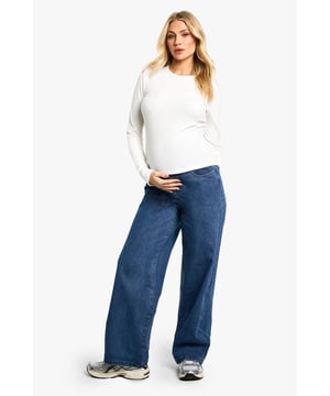 Wide-leg design for ultimate comfort and style
        High-waisted fit with stretchy waistband to accommodate growing bump
        Versatile denim fabric suitable for various occasions
        Relaxed fit through hips and thighs for ease of movement
        Full-length trousers with a floor-skimming hem
    
    Embrace your changing silhouette with these chic and comfortable wide-leg maternity jeans from Boohoo. Perfect for the fashion-forward mum-to-be, these trousers offer a relaxed fit that grows with you throughout your pregnancy. The high-waisted design and stretchy waistband provide ample support for your bump, while the wide-leg cut creates a flattering and on-trend silhouette. Style these versatile jeans for a range of occasions, from casual daytime outings to evening gatherings. Pair with a fitted top and trainers for a laid-back look, or dress them up with a flowing blouse and heeled boots for a night out. The denim fabric ensures durability and easy care, making these jeans a staple in your maternity wardrobe that you'll reach for time and time again.