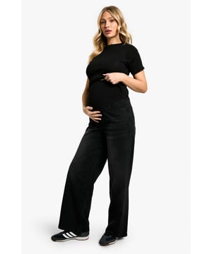 Wide-leg design for ultimate comfort and style
        High-waisted fit with stretchy waistband to accommodate growing bump
        Versatile denim fabric suitable for various occasions
        Short-sleeved top for easy layering and adaptability
        Relaxed fit throughout for unrestricted movement
    
    Embrace your changing silhouette with these chic and comfortable wide-leg maternity jeans from Boohoo. Perfect for the fashion-forward mum-to-be, these trousers offer a relaxed fit that grows with you throughout your pregnancy. The high-waisted design and stretchy waistband provide ample support for your bump, while the wide-leg cut creates a flattering and on-trend silhouette. Pair with the matching short-sleeved top for a coordinated look, or mix and match with your favourite maternity pieces. Ideal for day-to-night wear, these jeans can take you from casual outings to dinner dates with ease. Style with trainers and a cosy jumper for a laid-back daytime ensemble, or dress up with heels and a blouse for evening events. The versatile denim fabric ensures these jeans will become a staple in your maternity wardrobe, offering both style and comfort as you navigate this exciting chapter.