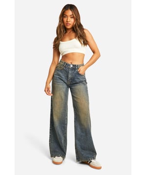 High-waisted design for a flattering silhouette
        Wide leg cut for maximum comfort and style
        Classic denim fabric with a vintage-inspired wash
        Functional pockets for practicality
        Versatile design suitable for various casual occasions
    
    These petite basics wide leg jeans with a high waist are the perfect addition to your casual wardrobe. The relaxed fit and vintage-inspired wash create a laid-back yet stylish look that's ideal for various casual events. Pair them with a simple white tee and trainers for a classic daytime ensemble, or dress them up with a cropped blouse and statement jewellery for family gatherings. The high-waisted design flatters your figure, while the wide leg cut offers freedom of movement. These jeans are a versatile staple that can be styled countless ways, making them a must-have for the fashion-forward woman who values both comfort and trend-setting style. Whether you're running errands or meeting friends for a casual lunch, these jeans will keep you looking effortlessly chic.