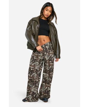 Eye-catching leopard print denim jeans
        Wide leg silhouette for a relaxed fit
        High-rise waist for a flattering shape
        Belt loops for versatile styling options
        Durable denim fabric for long-lasting wear
    
    Make a bold statement with these striking wide-leg jeans featuring an alluring leopard print. The high-rise waist creates a sleek silhouette, while the relaxed wide-leg cut offers both comfort and style. Perfect for those who love to stand out, these jeans can be dressed up or down for various casual occasions. Pair them with a simple black crop top and chunky trainers for a trendy daytime look, or style them with a fitted bodysuit and heeled boots for a night out with friends. The versatile design makes these jeans ideal for family gatherings, brunch dates, or casual shopping trips. Add a leather jacket for an edgy twist, or keep it simple with a plain white tee for a more laid-back vibe. These eye-catching jeans are sure to become a go-to piece in your wardrobe, offering endless styling possibilities for the fashion-forward individual.