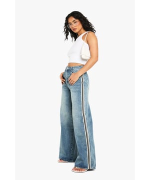 Wide leg silhouette for maximum comfort and on-trend appeal
        Distinctive side stripe detail adds a sporty, contemporary edge
        High-waisted design creates a flattering, elongated look
        Classic five-pocket styling for practicality and timeless appeal
        Cotton-rich fabric offers breathable comfort for all-day wear
    
    Make a statement with these eye-catching wide leg jeans from Boohoo. The standout side stripe detail gives these jeans a distinctive sporty vibe that works brilliantly for casual daywear. Style with a simple crop top as shown for a balanced silhouette that highlights the dramatic wide leg cut. These jeans are perfect for weekend brunches, shopping trips or casual family gatherings - simply pair with trainers and a crossbody bag for an effortlessly cool look. For cooler days, layer with an oversized jumper or denim jacket. The high-waisted cut is particularly flattering, creating length through the legs while the relaxed wide fit offers both comfort and fashion-forward appeal. A versatile addition to your casual wardrobe that combines current trends with everyday wearability.