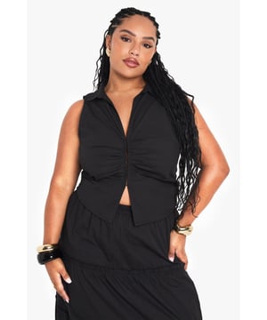 Sleeveless design for warm-weather comfort
        Unique pleated detail adds texture and interest
        V-neckline creates a flattering silhouette
        Cropped length perfect for pairing with high-waisted bottoms
        Versatile cotton poplin fabric for breathability
    
    This chic plus-size waistcoat is a must-have addition to your summer wardrobe. The pleated detail adds a touch of sophistication, while the sleeveless design keeps you cool and comfortable. Style it with the matching tiered maxi skirt for a coordinated look that's perfect for casual outings or family gatherings. For a more relaxed vibe, pair it with your favourite denim shorts and trainers. Accessorise with statement earrings and a woven handbag to complete the ensemble. The versatile nature of this piece allows for endless styling options, making it a go-to for various occasions. Whether you're heading to a garden party or a weekend brunch, this waistcoat will ensure you look effortlessly stylish.