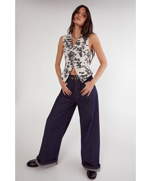 Striking dalmatian print denim waistcoat
        Longline silhouette for a contemporary edge
        Sleeveless design with a V-neckline
        Asymmetrical front closure for added intrigue
        Versatile piece suitable for layering or standalone wear
    
    Make a bold statement with this eye-catching denim longline waistcoat from Nasty Gal. The distinctive dalmatian print adds a playful twist to your ensemble, whilst the sleek silhouette ensures a flattering fit. Perfect for a night out on the town, pair this versatile piece with wide-leg trousers and chunky boots for an edgy urban look. Alternatively, layer it over a simple dress or crop top for a more daring outfit. The asymmetrical front closure adds an element of intrigue, allowing you to customise your look. Whether you're heading to a trendy bar or meeting friends for drinks, this waistcoat is sure to turn heads and spark conversations. Its unique design embodies the spirit of Nasty Gal's bold and daring aesthetic, making it a must-have addition to any fashion-forward wardrobe.