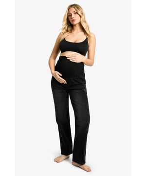Relaxed fit mom jeans designed for maternity wear
        High-rise waistband with stretchy panel for growing bump
        Roomy through hips and thighs for maximum comfort
        Tapered leg for a flattering silhouette
        Versatile denim fabric suitable for various occasions
    
    Embrace your changing shape with these stylish and comfortable maternity mom jeans from Boohoo. Perfect for the fashion-forward mum-to-be, these jeans offer a relaxed fit that adapts to your body throughout pregnancy. The high-rise waistband features a stretchy panel that grows with your bump, ensuring all-day comfort. The roomy cut through the hips and thighs provides ample space, while the tapered leg maintains a trendy silhouette. Pair with a fitted top and trainers for a casual daytime look, or dress them up with heels and a blazer for evening outings. These versatile jeans effortlessly transition from desk to dinner, making them an essential addition to your maternity wardrobe. Style them with a cosy oversized cardigan and ankle boots for a chic autumn ensemble that keeps you comfortable and on-trend throughout your pregnancy journey.