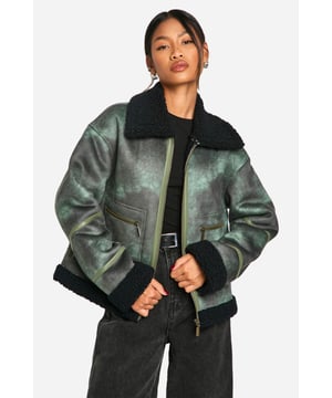 Vintage-inspired aviator jacket with a modern twist
        Cosy teddy lining for extra warmth and comfort
        Oversized fit for a relaxed, on-trend silhouette
        Asymmetrical zip closure for a unique edge
        Multiple pockets for practicality and style
    
    Embrace the cool-girl aesthetic with this striking aviator jacket. The vintage-inspired design is given a contemporary update with its oversized silhouette and asymmetrical zip closure. Perfect for those chilly autumn days, the teddy lining provides exceptional warmth without compromising on style. Pair it with wide-leg trousers and chunky trainers for an effortlessly chic daytime look. For evening outings, throw it over a little black dress and ankle boots to add an edgy contrast to your ensemble. Whether you're heading to a casual brunch or a night out with friends, this versatile piece will keep you looking fashionable and feeling cosy. The multiple pockets offer both practicality and style, making this jacket a must-have addition to your wardrobe that you'll reach for time and time again.