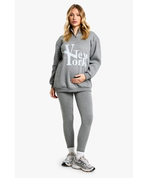 Comfortable cotton-mix fabric for all-day wear
        Bold 'New York' print on the sweatshirt for urban flair
        High-waisted leggings for a flattering silhouette
        Convenient zip detail for easy dressing
        Versatile two-piece set perfect for maternity loungewear
    
    Embrace comfort and style during your pregnancy with this chic maternity leggings set. The soft cotton-mix fabric ensures all-day comfort, while the bold 'New York' print on the sweatshirt adds a touch of urban sophistication. The high-waisted leggings provide gentle support for your growing bump, and the convenient zip detail makes dressing a breeze. Perfect for leisurewear, this versatile set can be styled for various casual outings. Pair with trendy trainers and a denim jacket for a cool mum-to-be look when running errands, or layer with a longline cardigan and slip-on shoes for a cosy day at home. The neutral grey hue allows for easy mixing and matching with your existing wardrobe, making this set a must-have for expectant mums who value both comfort and fashion-forward style.