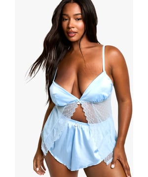 Dreamy cloud-inspired design for a whimsical touch
        Flattering babydoll silhouette with flared hem
        Delicate lace detailing for added allure
        Adjustable spaghetti straps for a customised fit
        Inclusive sizing to celebrate every body type
    
    Embrace your inner goddess with this enchanting plus-size babydoll from Boohoo's Valentine's Day collection. The ethereal cloud-inspired pattern adds a touch of whimsy to your intimate moments, while the flirty silhouette accentuates your curves in all the right places. The delicate lace detailing and adjustable straps ensure both comfort and allure. Perfect for a romantic night in or as a confidence-boosting addition to your lingerie drawer, this piece is versatile enough to pair with your favourite dressing gown for leisurely mornings. The soft, stretchy fabric moves with you, making it ideal for lounging or adding a playful touch to your sleepwear rotation. Celebrate your unique beauty and feel fabulous in this dreamy babydoll that's designed to make you feel like you're floating on cloud nine.