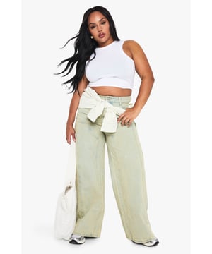 Straight leg design for a classic silhouette
        Vintage wash effect for a lived-in look
        High-rise waist for a flattering fit
        Embroidered back pocket detail for added flair
        Wide leg opening for a relaxed, comfortable feel
    
    These plus-size straight leg jeans from Boohoo are the perfect blend of comfort and style. The vintage wash adds a touch of retro charm, while the straight leg cut offers a timeless look that's both flattering and versatile. The high-rise waist cinches you in at your smallest point, creating a sleek silhouette. For a casual day out, pair these jeans with a simple white vest top and trainers, as seen on the model. Add a denim jacket for a double denim look that's right on trend. These jeans are also ideal for family gatherings or casual Friday at the office - just swap the trainers for ankle boots and add a blazer for a smart-casual ensemble. The embroidered back pocket detail adds a unique touch, making these jeans stand out from the crowd. Whether you're running errands or meeting friends for coffee, these jeans will keep you comfortable and stylish all day long.