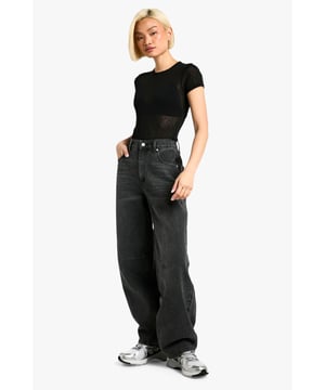 Tapered fit for a modern silhouette
        Distinctive seam detailing adds visual interest
        High-rise waist with belt loops for versatile styling
        Rigid denim construction for a structured look
        Wide-leg design for a relaxed, on-trend appearance
    
    Make a bold statement with these eye-catching tapered jeans from Boohoo. The unique seam detailing sets these trousers apart, offering a contemporary twist on a classic wardrobe staple. Perfect for the fashion-forward woman who values both style and comfort, these jeans can effortlessly transition from day to night. Pair them with a cropped tee and trainers for a casual daytime look, or dress them up with a fitted bodysuit and heels for an evening out. The high-rise waist and wide-leg silhouette create a flattering shape that complements various body types. Whether you're heading to a family gathering or meeting friends for coffee, these jeans provide the ideal blend of comfort and style. Embrace the latest trends while maintaining your individual flair with these versatile and striking denim trousers.