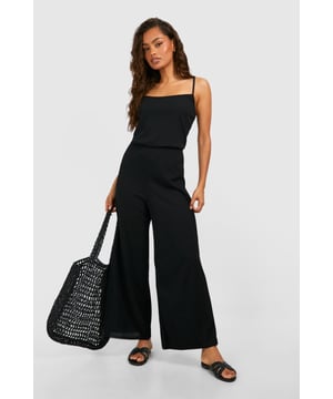 Ribbed texture for added visual interest
        Square neckline for a modern, flattering look
        Wide-leg culotte style for comfort and ease of movement
        Sleeveless design perfect for warmer weather
        Versatile one-piece outfit for effortless styling
    
    Embrace laid-back chic with this ribbed basic culotte jumpsuit from Boohoo. The square neckline adds a contemporary touch, while the wide-leg culotte style ensures both comfort and style. Perfect for casual outings, this jumpsuit can be dressed up or down with ease. Pair it with flat sandals and a woven tote for a relaxed daytime look, or add statement earrings and strappy heels for an evening out. The sleeveless design makes it ideal for warm weather, but it can also be layered with a lightweight cardigan or denim jacket for cooler days. Whether you're heading to a family gathering or meeting friends for brunch, this versatile jumpsuit is sure to become a go-to piece in your wardrobe.