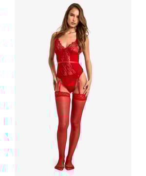 Intricate lace detailing for a romantic touch
        Sheer mesh panels create a sultry silhouette
        Adjustable shoulder straps for a customised fit
        Suspender straps add a classic lingerie element
        Matching thong included for a coordinated set
    
    Indulge in the allure of this captivating lace suspender basque and thong set from Boohoo. The delicate lace fabric intertwines with sheer mesh panels to create a tantalising play of reveal and conceal. The basque features a plunging neckline and a figure-hugging design that accentuates your curves. Adjustable shoulder straps ensure a perfect fit, while the suspender straps add a touch of vintage glamour. The included matching thong completes the ensemble, offering a coordinated look from top to bottom. This set is ideal for those moments when you want to feel confident and sensual in your own skin. Whether it's for a special occasion or simply to treat yourself, this lingerie set is sure to make you feel like the belle of the boudoir.
