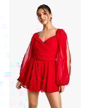 Elegant chiffon playsuit featuring dramatic split sleeves for a statement silhouette
        Flattering sweetheart neckline with a wrapped bodice design that accentuates your figure
        Billowing balloon sleeves create a romantic, ethereal look perfect for evening occasions
        Lightweight, flowing fabric offers comfortable movement for dancing the night away
        Relaxed fit shorts provide both style and practicality for your night out adventures
    
    Make an unforgettable entrance in this show-stopping chiffon playsuit from Boohoo. The striking split sleeve design creates a captivating silhouette that commands attention, whilst the wrapped bodice elegantly frames your dcolletage. Perfect for those special nights out, this playsuit effortlessly combines sophistication with playfulness. Style with strappy heels and statement earrings as shown for maximum impact at cocktail parties or club nights. The flowing fabric catches the light beautifully as you move, making it ideal for dancing until dawn. For cooler evenings, layer with a cropped jacket without compromising on the dramatic sleeve detail. This versatile piece transitions seamlessly from drinks with the girls to more upscale evening events with the right accessories.