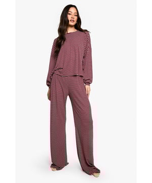 Striped jersey loungewear set designed for tall frames
        Relaxed fit top with dropped shoulders and long sleeves
        Wide-leg trousers with comfortable elastic waistband
        Soft, stretchy fabric for ultimate comfort
        Versatile two-piece set for lounging and sleeping
    
    Embrace laid-back luxury with this striped loungewear set, perfectly tailored for taller figures. The jersey fabric offers a gentle stretch, ensuring you stay cosy whether you're having a lazy Sunday or settling in for a good night's sleep. The relaxed-fit top features dropped shoulders and long sleeves, providing ample coverage and movement. Paired with wide-leg trousers that sport an elastic waistband, this set prioritises comfort without compromising on style. The classic stripe pattern adds a touch of casual chic, making it ideal for those moments when you want to feel put-together, even in your downtime. Layer with a soft dressing gown for chilly mornings, or wear the pieces separately to mix and match with your existing loungewear collection. This Boohoo set is the ultimate choice for the fashion-forward woman who values both comfort and trend-led design in her nightwear.