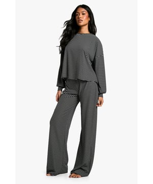 Tall-fit striped jersey loungewear set
        Relaxed, oversized silhouette for ultimate comfort
        Long-sleeved top with dropped shoulders
        Wide-leg trousers with elasticated waistband
        Versatile two-piece set for lounging and sleeping
    
    Embrace laid-back luxury with this tall-fit striped loungewear set from Boohoo. Crafted from soft jersey fabric, this two-piece ensemble offers the perfect blend of style and comfort for your nighttime routine. The oversized top features a relaxed fit with dropped shoulders, providing ample room for movement, while the wide-leg trousers with an elasticated waistband ensure a snug yet comfortable fit. Whether you're settling in for a cosy night of binge-watching or catching up on beauty sleep, this versatile set has got you covered. Style it with fluffy slippers and a plush dressing gown for the ultimate lounging experience, or pair the separates with casual daywear pieces for a chic, off-duty look. This Boohoo loungewear set is the epitome of effortless style, perfect for the fashion-forward woman who values both comfort and trend-setting appeal in her nightwear collection.