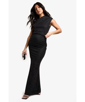 Glittering stretch maxi skirt designed for maternity wear
        Figure-hugging silhouette that adapts to your changing shape
        Floor-length design for a dramatic, elegant look
        Comfortable elastic waistband to accommodate growing bump
        Versatile piece suitable for various festive occasions
    
    Make a dazzling entrance at your next holiday soire with this stunning maternity maxi skirt from Boohoo. The all-over glitter fabric catches the light beautifully, ensuring you'll shine at any festive celebration. The stretch material and elastic waistband offer supreme comfort, adapting to your changing silhouette throughout your pregnancy. Style this skirt with a fitted black top and strappy heels for a chic Christmas party ensemble. For a more relaxed Christmas Day look, pair it with a soft jumper and ballet flats. This versatile piece can be dressed up or down, making it a must-have addition to your maternity wardrobe. Whether you're attending a formal dinner or a casual gathering, this glittering maxi skirt will keep you feeling confident and stylish throughout the festive season.