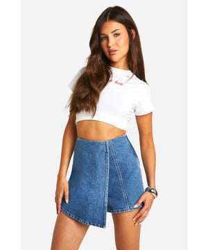 Secure a wardrobe staple this season with this denim skirt from our latest collection. The perfect tool for day-to-night dressing, denim skirts for women are a wardrobe staple which never go out of style. Featuring a rigid denim fabric that can be dressed up or down, we're talking wear anywhere and everywhere kinda vibes. Let your style transcend the seasons and rock a denim skirt with a striped top and flat chunky boots. Versatile all year round, this jean skirt looks just as dreamy worn with a jumper or a crop top, winning. We love a white denim skirt with a cute top for summer fits and classic black denim skirts for easy throw-on-and-go looks.Style: SkortsFabric: Cotton