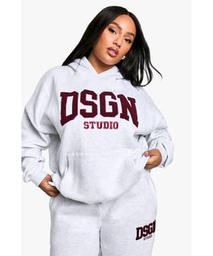 Oversized fit for ultimate comfort and style
        Towelling fabric adds texture and warmth
        Bold DSGN Studio appliqu on the front
        Hooded design for casual cool
        Versatile piece for lounging or street style
    
    Make a statement in this Plus Oversize Hoodie with its eye-catching DSGN Studio appliqu. The towelling fabric adds a unique texture, perfect for those who want to stand out from the crowd. Its relaxed fit allows for easy layering, making it ideal for transitional weather. Style it with matching joggers and trainers for a coordinated athleisure look, or throw it over leggings for a quick coffee run. This hoodie is your go-to for casual events, family gatherings, or lazy weekends at home. The versatility of this piece means you can dress it up with accessories for a night out with friends or keep it low-key for a day of errands. With its blend of comfort and style, this hoodie is set to become a staple in your wardrobe, offering endless styling possibilities for the fashion-forward woman who values both trendiness and comfort.