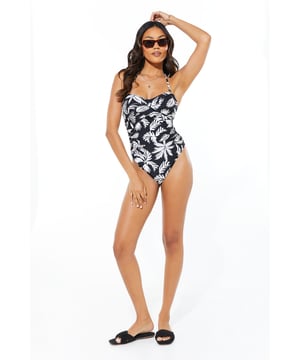 Versatile bandeau neckline with detachable straps
        Elegant wrap detail enhancing the silhouette
        Alluring all-over print for a stylish beach look
        Figure-flattering one-piece design
        Machine washable for easy care
    
    Make a splash this summer with this captivating wrap detail swimsuit from Debenhams. The bandeau neckline offers a chic, tan-line-free option, while the detachable straps provide versatility and support when needed. The wrap detail cleverly accentuates your curves, creating a flattering silhouette that's perfect for lounging by the pool or strolling along the beach. Pair with oversized sunglasses and a wide-brimmed hat for ultimate seaside glamour. For a coordinated beach ensemble, throw on a sheer kaftan and slip into some metallic sandals. Whether you're jetting off to a tropical paradise or enjoying a staycation, this swimsuit is your go-to for sophisticated beachwear that combines style and comfort effortlessly.