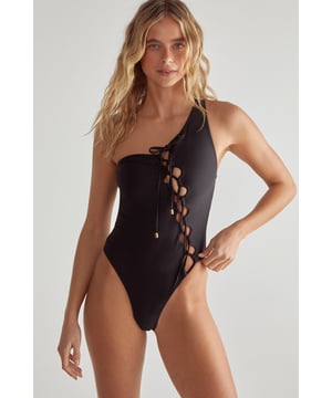 Striking one-shoulder design for a bold, asymmetrical look
        Alluring lace-up detail along the side for adjustable fit
        High-cut leg openings to elongate the silhouette
        Sleek, form-fitting swimsuit that hugs your curves
        Versatile style suitable for both swimming and lounging
    
    Make waves this summer with Nasty Gal's captivating Lace Up One Shoulder Swimsuit. This head-turning piece combines contemporary design with classic allure, perfect for the fashion-forward beach-goer. The asymmetrical neckline adds a touch of drama, while the daring lace-up detail allows for a customised fit and reveals just the right amount of skin. Whether you're taking a dip in the pool or sunbathing on the sand, this swimsuit ensures you'll stand out from the crowd. Pair it with oversized sunglasses and a wide-brimmed hat for ultimate poolside glamour, or throw on a sheer kaftan and strappy sandals for a chic beach bar ensemble. From tropical getaways to staycation pool parties, this versatile swimsuit is your ticket to sizzling summer style.