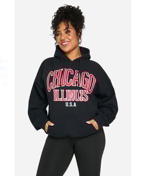 Oversized fit for ultimate comfort and style
        Bold 'Chicago Illinois USA' graphic print
        Cosy hood for added warmth
        Practical front pocket for essentials
        Versatile jersey fabric suitable for various casual occasions
    
    Make a statement with this eye-catching oversized hoodie, perfect for those who want to showcase their love for the Windy City. The bold graphic print takes centre stage, adding a touch of urban flair to your casual wardrobe. Pair it with your favourite leggings and trainers for a laid-back look that's ideal for weekend brunches or casual meet-ups with friends. The roomy fit allows for easy layering, making it a great choice for unpredictable British weather. Whether you're running errands or lounging at home, this hoodie offers both style and comfort. Its versatility shines through as it can be dressed up with dark jeans and ankle boots for a night out at the local pub, or kept casual with joggers for a cosy night in. The front pocket is perfect for keeping your hands warm or storing small essentials, while the hood provides extra protection on breezy days.