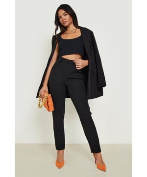 High-waisted design for a flattering silhouette
        Tapered leg for a modern, streamlined look
        Tailored fit offers a polished appearance
        Versatile trousers suitable for various occasions
        Stretch fabric allows for comfortable movement
    
    These high-waist tapered tailored suit trousers from Boohoo are a versatile addition to any fashion-forward wardrobe. The tailored fit creates a sleek silhouette, while the tapered leg adds a contemporary touch. Perfect for the confident woman who wants to make a statement, these trousers can be styled for both professional and social settings. For a chic office look, pair them with a crisp white blouse and pointed-toe court shoes. Transition effortlessly to evening wear by swapping the blouse for a stylish crop top, as seen on the model. Add a blazer for a complete suit ensemble, or dress them down with a casual jumper for a smart-casual vibe. The stretch fabric ensures all-day comfort, making these trousers ideal for long days at work or nights out on the town. Accessorise with bold jewellery and a clutch bag to complete your look for any urban nightlife adventure.