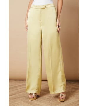 Luxurious satin fabric for a smooth, elegant finish
        Wide leg silhouette for a dramatic, flowing look
        High-waisted design with a tailored fit
        Side pockets for practicality and style
        Floor-skimming length for a sophisticated appearance
    
    Make a statement at your next formal event with these stunning wide leg tailored trousers from Oasis. The satin fabric lends a luxurious sheen that catches the light beautifully as you move, whilst the wide leg cut creates a striking silhouette that's both comfortable and chic. Perfect for weddings, races, or any occasion that calls for elegance, these trousers can be styled in numerous ways. For a coordinated look, pair with the matching blazer as shown, or create contrast with a fitted blouse. The high-waisted design elongates your legs, especially when worn with heels. Accessorise with delicate jewellery to complement the trousers' refined aesthetic. These versatile trousers transition effortlessly from day to night, making them a valuable addition to your occasion wear wardrobe.