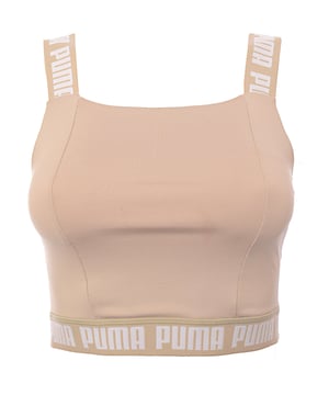Main: 90% Polyester, Main: 10% Elastane. The Puma Training Strong crop top is a stylish and functional piece for your workout wardrobe. With its square neckline and stone-neutral color, it offers a chic look that doesn't sacrifice comfort or performance. The branding on the straps and band adds a bold touch, making it clear that you're wearing a piece designed for those who take their training seriously. Whether you're hitting the gym or just enjoying a casual day out, this crop top is sure to make a statement.
