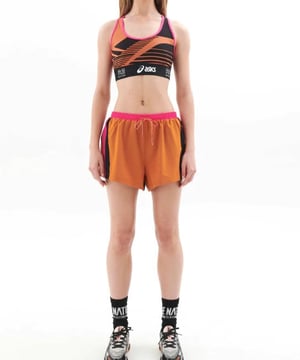 92% Recycled Polyester &amp; 8% Elastane. Running short made with lightweight recycled spray fabrication. Encased elastic waistband with an internal mesh brief. 2X zip pockets on side along with a P.E Nation printed logo