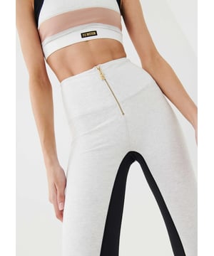 90% Organic Cotton &amp; 10% Elastane. High rise full length legging with an organic cotton fabrication. Premium stretch and recovery. Gold plated faux zipper centre front and gold plated zippers at ankles. P.E Nation logo patch