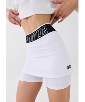 65% recycled nylon &amp; 35% elastane. The P.E Nation Follow Through Skort combines the best of both worlds, the appeal and aesthetic of a skirt with the comfort and ease of shorts. Featuring a thick elasticated waistband, longer under shorts and a short skirt. Head to the court in style. Pair with the Forefront.