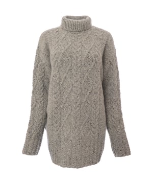 The Paul Smith Women's Sweater in grey, made from 70% wool and 30% mohair, offers luxurious softness and warmth. This versatile sweater is perfect for cooler weather and can be styled up or down for different occasions.