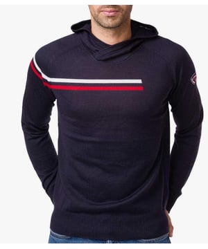 50% Virgin Wool 50% Acrylic. The Diago hood is a men's hooded sweater made from merino wool. The iconic tri-colour stripe that is cut into the three quarters of the jersey to symbolize the exit on the court pays homage to the brand's history. Sporty chic clothing uses Rossignol symbols to combine sport, authenticity and elegance