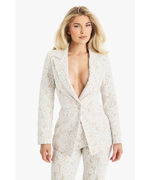 Exquisite lace detailing for a luxurious look
        Slim fit design for a sleek silhouette
        Single-button closure for a polished finish
        Collared neckline adds a touch of sophistication
        Versatile piece suitable for various formal occasions
    
    Make a lasting impression with this stunning lace blazer from Boohoo. Perfect for the fashion-forward woman who desires to stand out at any formal event. The intricate lace pattern adds a touch of romance and elegance, while the slim fit accentuates your figure beautifully. Style it with matching trousers for a coordinated suit look, or pair it with a sleek midi dress for a chic ensemble. Ideal for weddings, races, or graduations, this blazer offers endless styling possibilities. For a more relaxed yet refined look, team it with tailored trousers and a silk camisole. Add some delicate jewellery and strappy heels to complete your outfit. This versatile piece will quickly become a go-to in your wardrobe for those moments when you want to radiate confidence and sophistication.