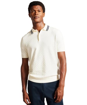 Elevate your everyday wardrobe with the MAHANA polo shirt, designed for effortless style and all-day comfort. Crafted from a premium wool blend, this polo offers a soft feel with a refined textured stitch for added sophistication. The classic button placket and short-sleeved design make it a versatile choice for both smart and casual occasions. Featuring a stylish striped collar, this polo blends traditional charm with modern detailing