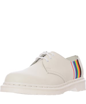 Upper: 100% Leather, Lining: 100% Leather, Sole: 100% Polyvinylchloride. The Dr. Martens 1461 Pride shoes are a vibrant celebration of inclusivity and diversity, featuring the iconic design of the classic 1461 silhouette in a crisp white. These shoes proudly display the colors of the Progress Pride flag, symbolizing support and solidarity with the LGBTQIA+ community. Not only do they make a bold fashion statement, but they also stand as a testament to Dr. Martens' commitment to championing individuality and freedom of expression. With their durable construction and timeless style, these shoes are perfect for anyone looking to make a statement while enjoying the renowned comfort and toughness of Dr. Martens footwear.